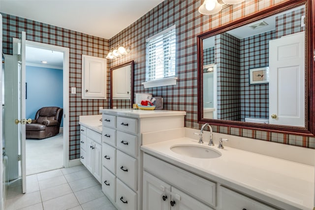 full bathroom featuring tile patterned floors, visible vents, wallpapered walls, and vanity