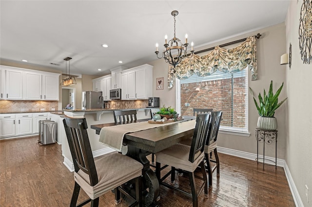 dining space featuring recessed lighting, an inviting chandelier, baseboards, and dark wood-style flooring