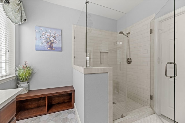 bathroom with vanity and a shower stall