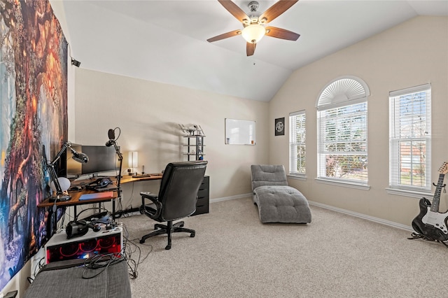 carpeted home office featuring baseboards, a ceiling fan, and vaulted ceiling