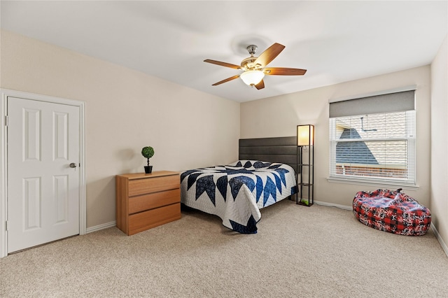 carpeted bedroom with baseboards and ceiling fan