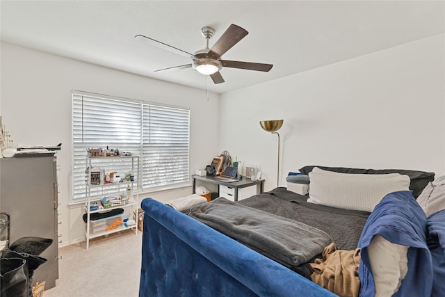 bedroom featuring light colored carpet and ceiling fan