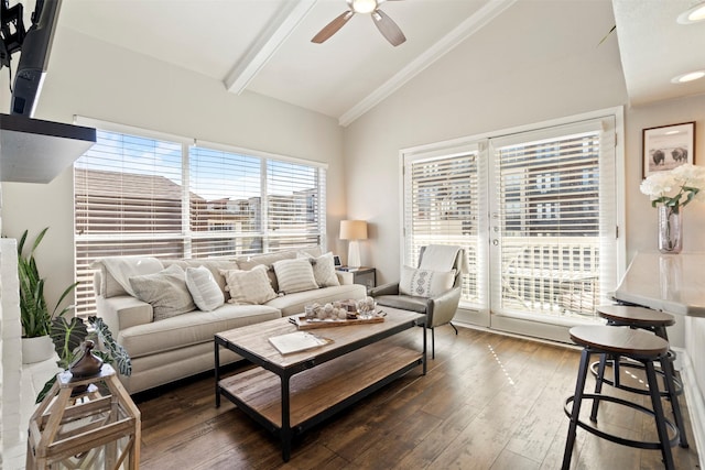 living area with vaulted ceiling with beams, a ceiling fan, and hardwood / wood-style flooring