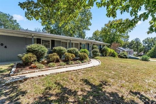 view of front of property with a front lawn