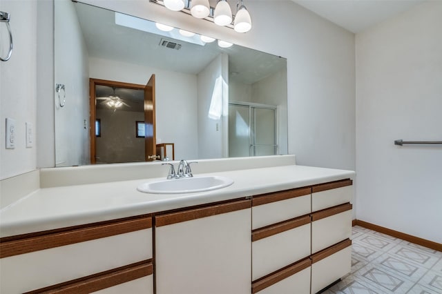 bathroom featuring visible vents, baseboards, a stall shower, tile patterned floors, and vanity