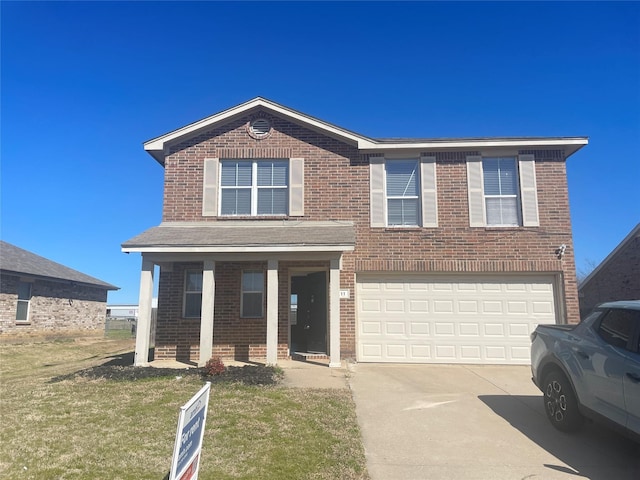 traditional home with concrete driveway, a garage, brick siding, and a front yard