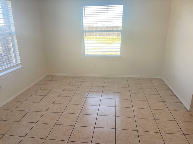 spare room featuring baseboards