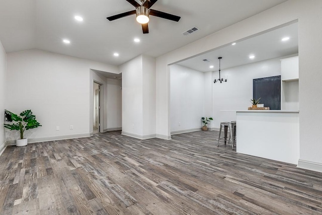 559 Helena St, Dallas, TX 75217 - unfurnished living room featuring wood finished floors, a ceiling fan, recessed lighting, baseboards, and a chandelier