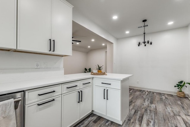 559 Helena St, Dallas, TX 75217 - kitchen with wood finished floors, a peninsula, white cabinetry, light countertops, and recessed lighting