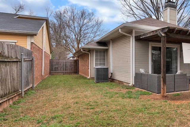 view of yard featuring cooling unit and a fenced backyard