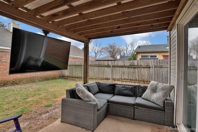 view of patio featuring an outdoor living space and fence