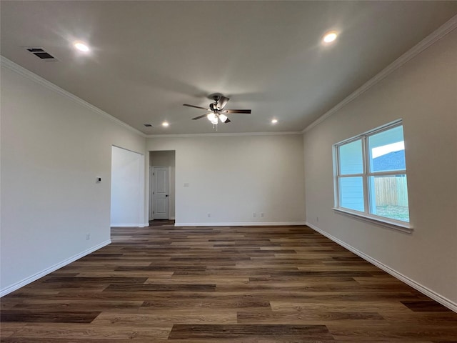 unfurnished room featuring dark wood finished floors, baseboards, and ornamental molding