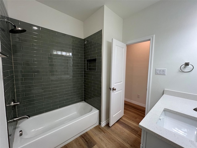 full bathroom featuring vanity,  shower combination, wood finished floors, and baseboards