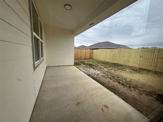 view of patio / terrace featuring fence