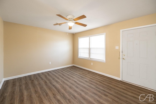 entrance foyer featuring baseboards and dark wood-style flooring