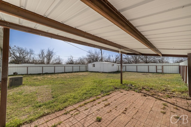 view of yard featuring cooling unit, a patio area, and a fenced backyard