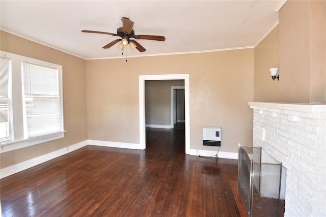 unfurnished living room featuring ornamental molding, heating unit, wood-type flooring, a fireplace, and baseboards