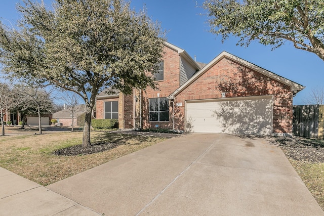 view of front of house featuring brick siding, concrete driveway, an attached garage, and fence