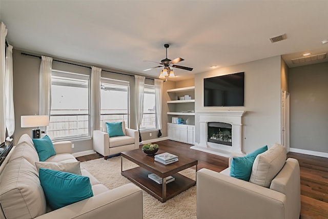 713 Cross Meadow Blvd, Mansfield, TX 76063 - living room featuring baseboards, ceiling fan, wood finished floors, a fireplace with raised hearth, and recessed lighting