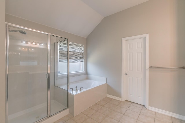 bathroom with lofted ceiling, a bath, a shower stall, and tile patterned flooring