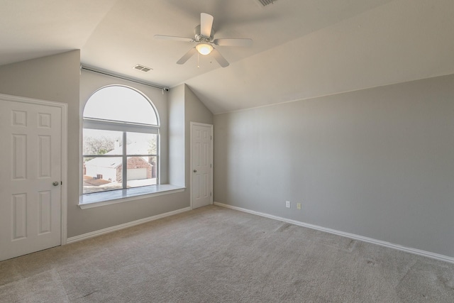 bonus room featuring visible vents, lofted ceiling, a ceiling fan, carpet floors, and baseboards