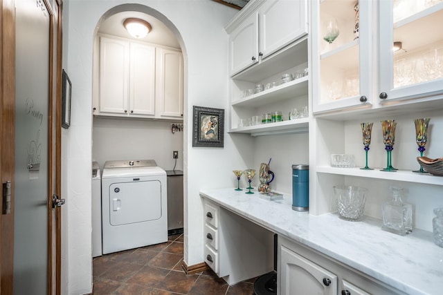 laundry room featuring washer and dryer and cabinet space