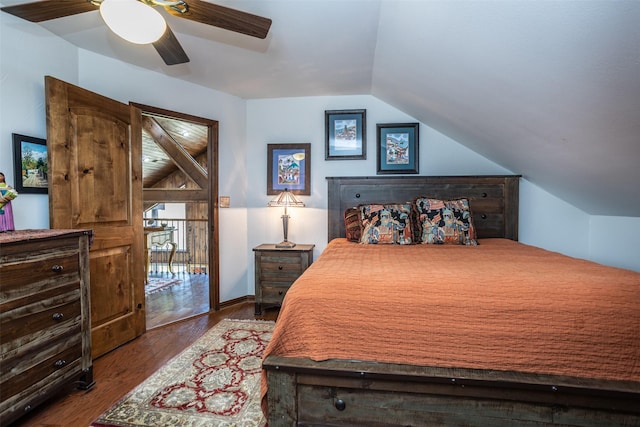 bedroom featuring a ceiling fan, vaulted ceiling, and wood finished floors