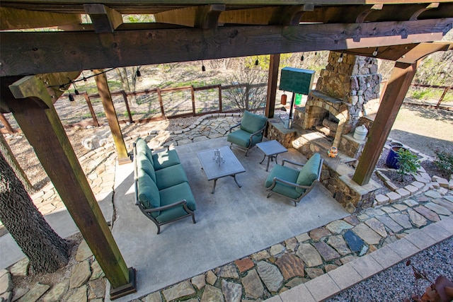 view of patio / terrace with an outdoor stone fireplace