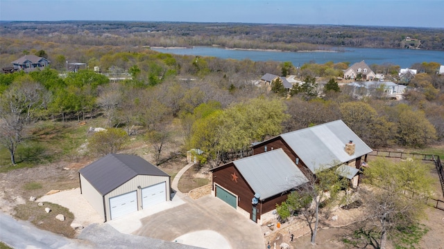 bird's eye view with a view of trees and a water view