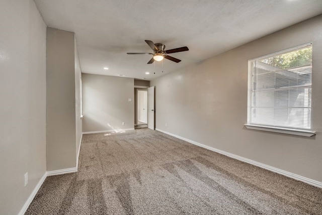 empty room with recessed lighting, baseboards, carpet, and a ceiling fan