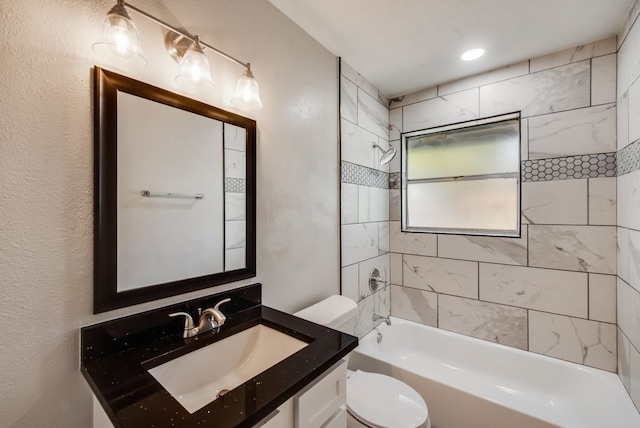 full bath with vanity, toilet, and shower / bathtub combination