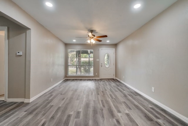 unfurnished living room with recessed lighting, baseboards, wood finished floors, and ceiling fan