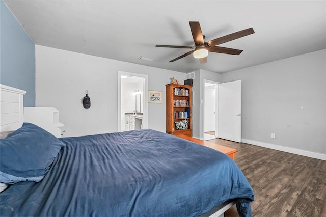 bedroom featuring visible vents, connected bathroom, ceiling fan, baseboards, and wood finished floors