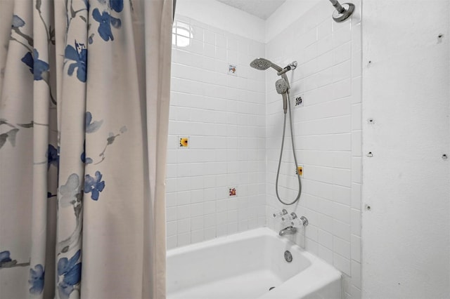 bathroom with shower / bath combination with curtain