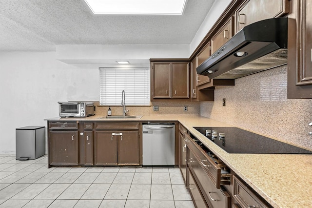 kitchen featuring a sink, dark brown cabinetry, under cabinet range hood, stainless steel dishwasher, and black electric cooktop