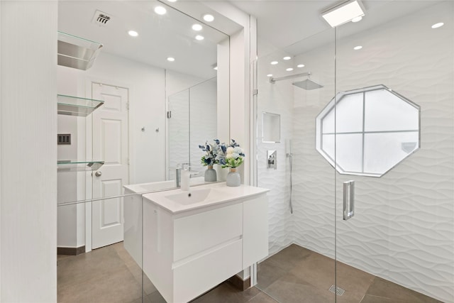 full bathroom featuring recessed lighting, visible vents, vanity, and a shower stall