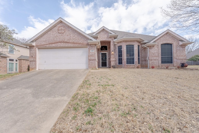 single story home with a front yard, brick siding, concrete driveway, and an attached garage