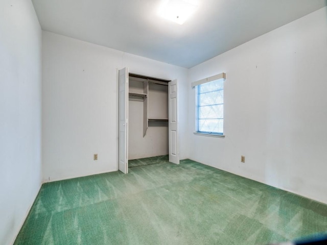 unfurnished bedroom featuring a closet and carpet floors