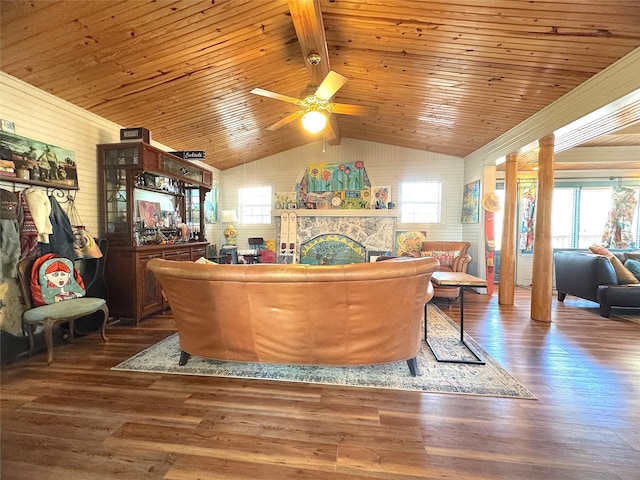 interior space featuring wooden ceiling, vaulted ceiling with beams, wood finished floors, and a fireplace