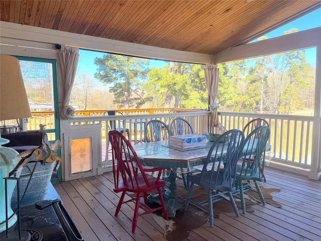 wooden terrace featuring outdoor dining area