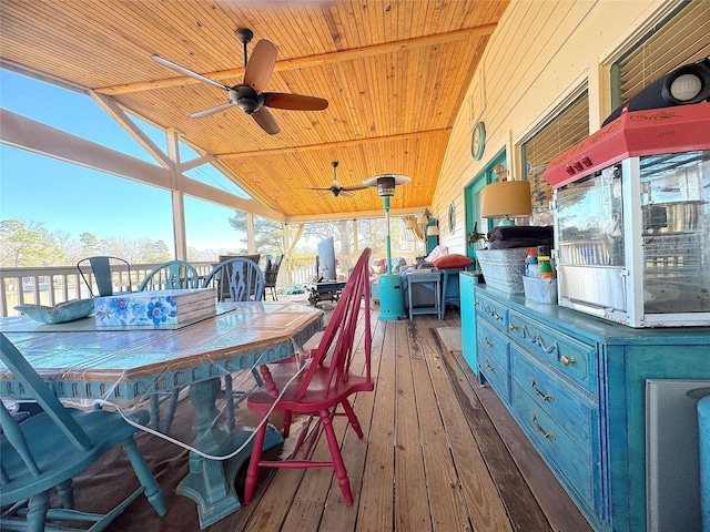 wooden deck featuring a ceiling fan