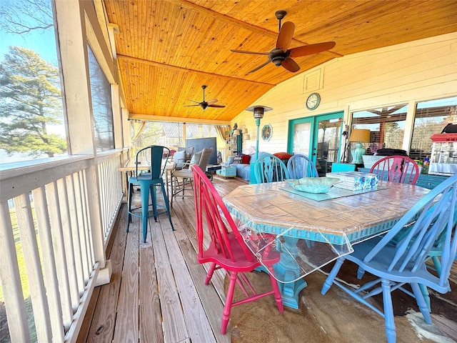 exterior space with outdoor dining area and ceiling fan