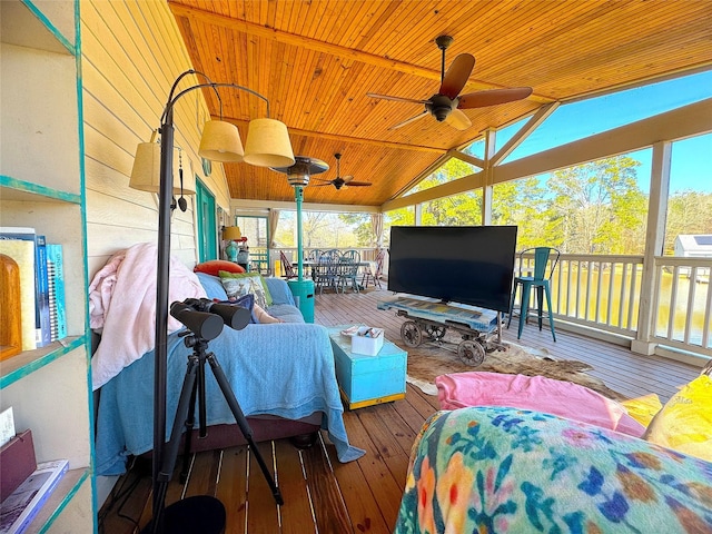 exterior space with a ceiling fan, vaulted ceiling, and wood ceiling