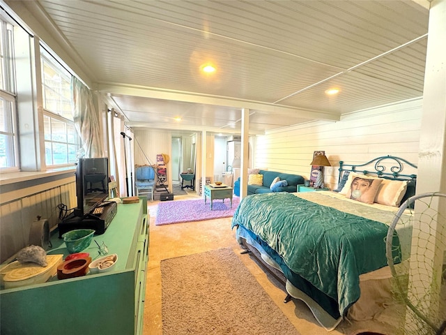 bedroom featuring wooden walls