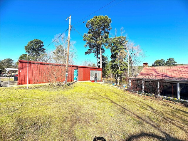 view of yard featuring an outbuilding and a pole building