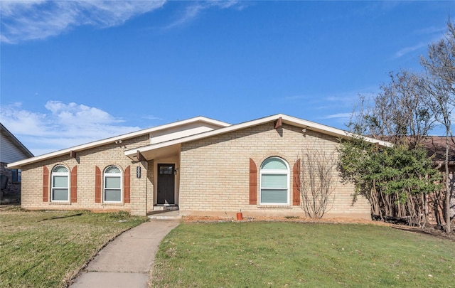 ranch-style house with brick siding and a front lawn