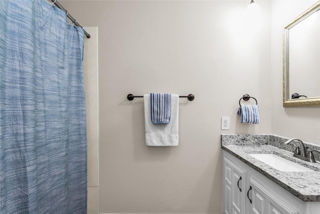 full bathroom with vanity and a shower with curtain