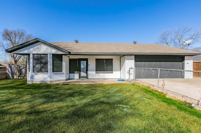 view of front of home with driveway, a front yard, and fence