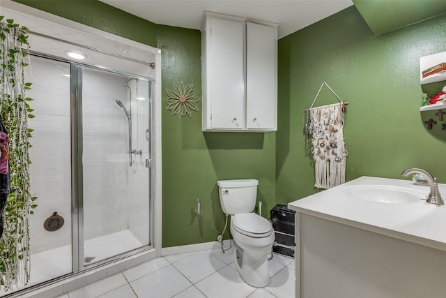 full bath featuring tile patterned floors, toilet, a stall shower, baseboards, and vanity