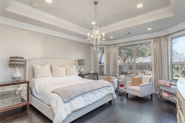 bedroom featuring visible vents, a raised ceiling, wood finished floors, and wallpapered walls